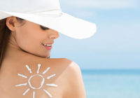 Sun Drawn On Woman's Shoulder With Sun Protection Cream